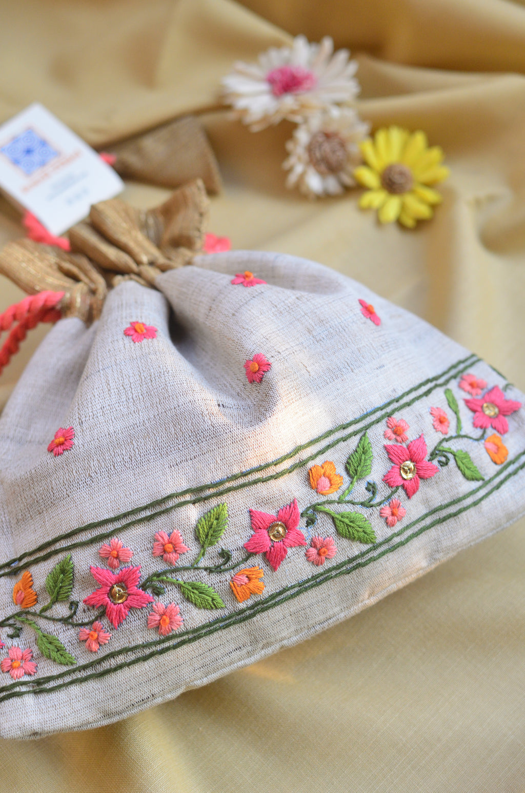 Snigdha - Off white raw silk potli with hand embroidered border image 1