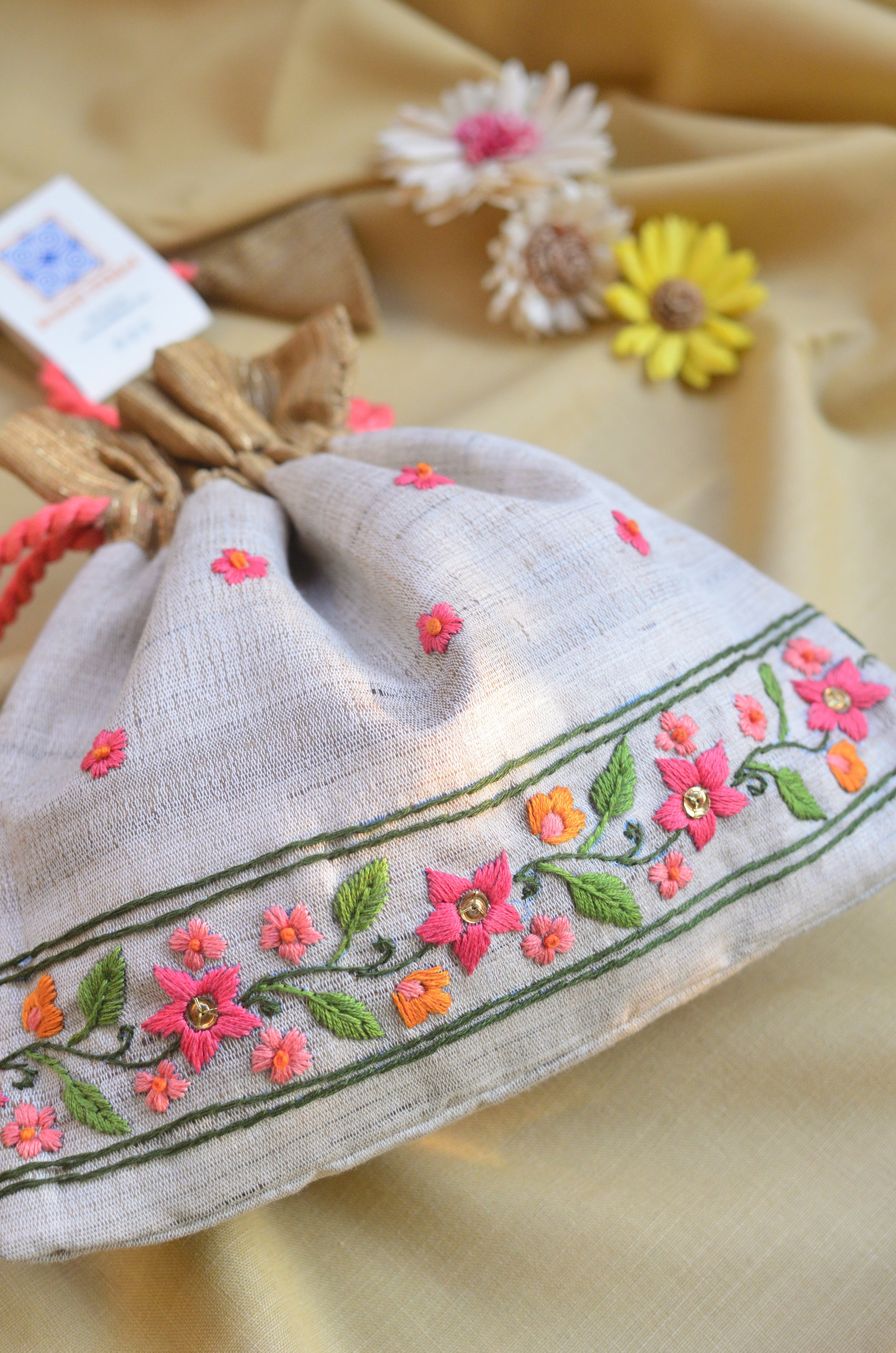 Snigdha - Off white raw silk potli with hand embroidered border image 1