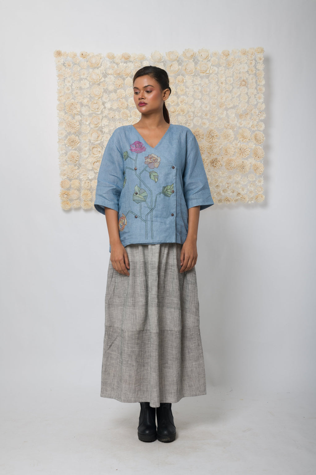 Powder blue floral appliqué V-neck top