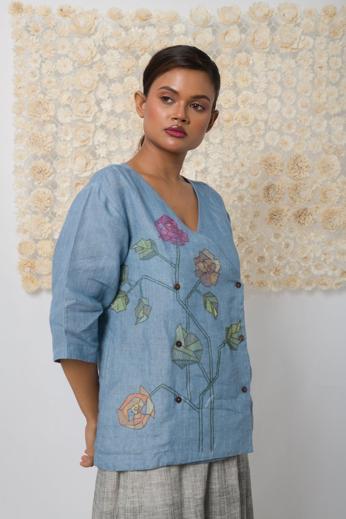 Powder blue floral appliqué V-neck top
