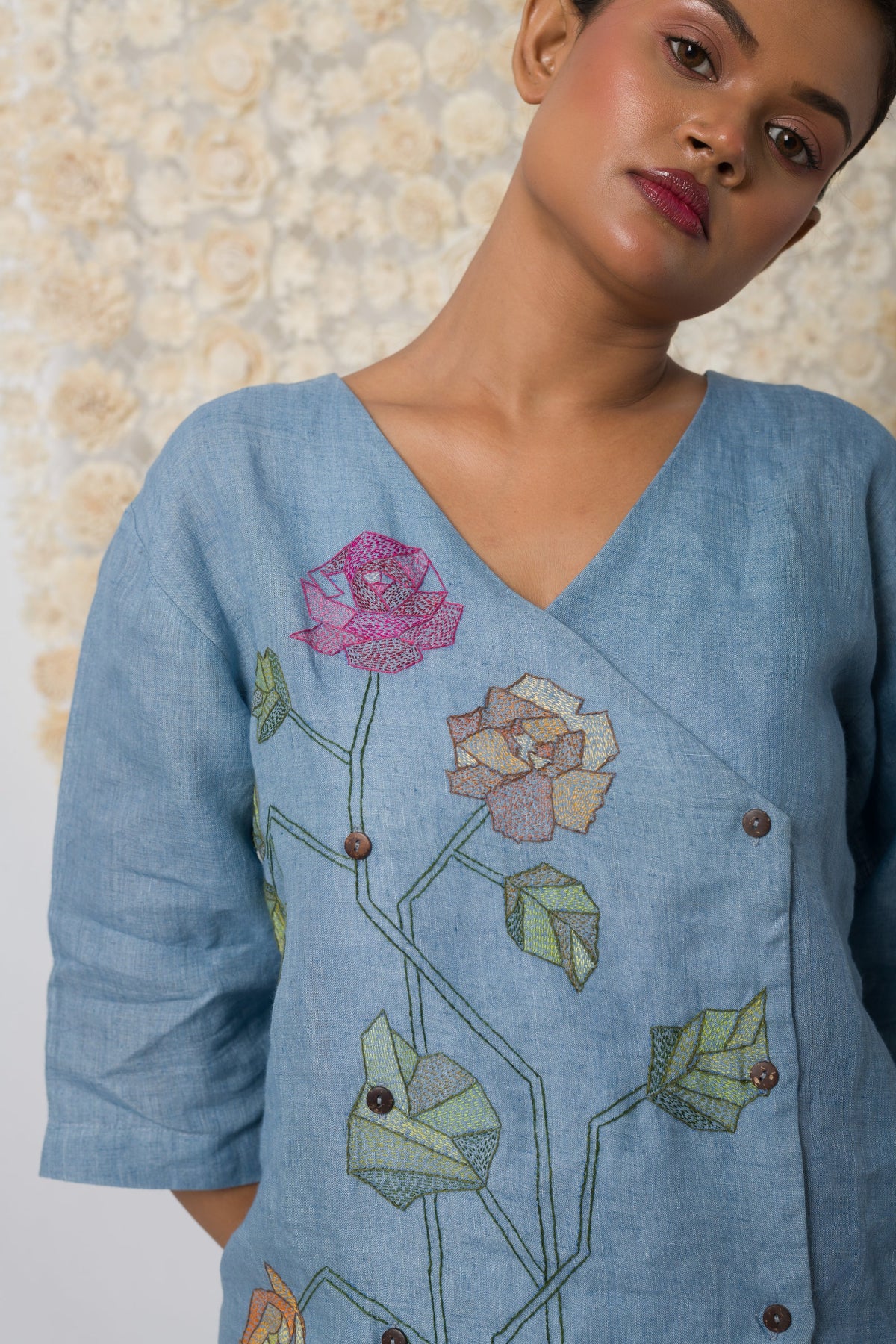 Powder blue floral appliqué V-neck top
