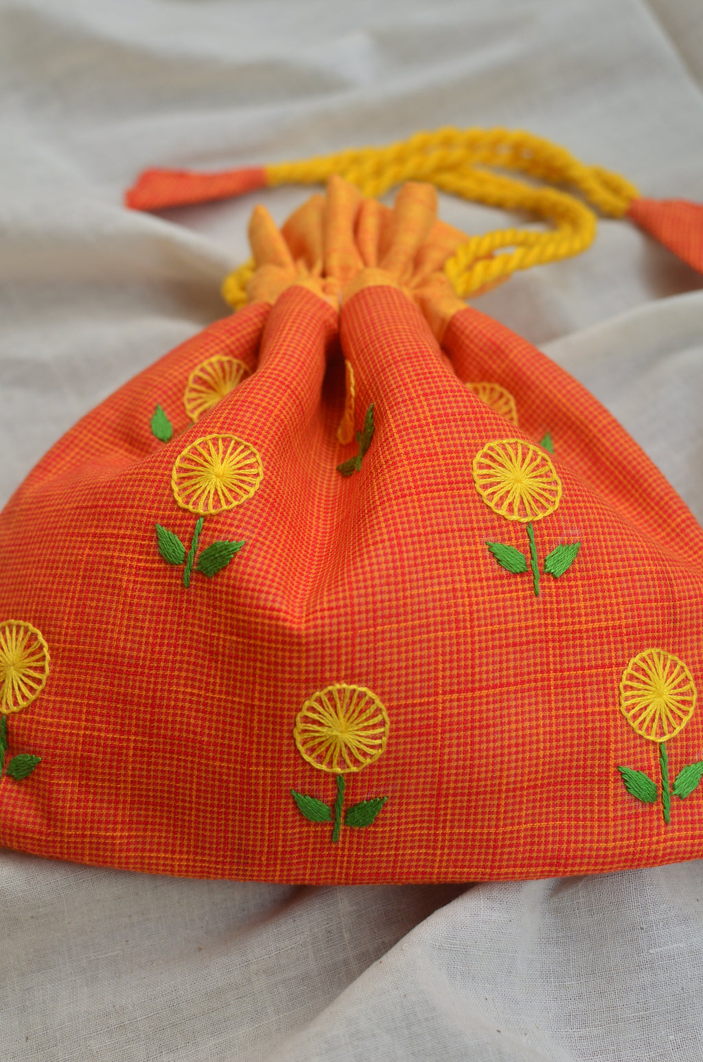 Hand embroidered cotton potli - Yellow flowers on orange base image 1