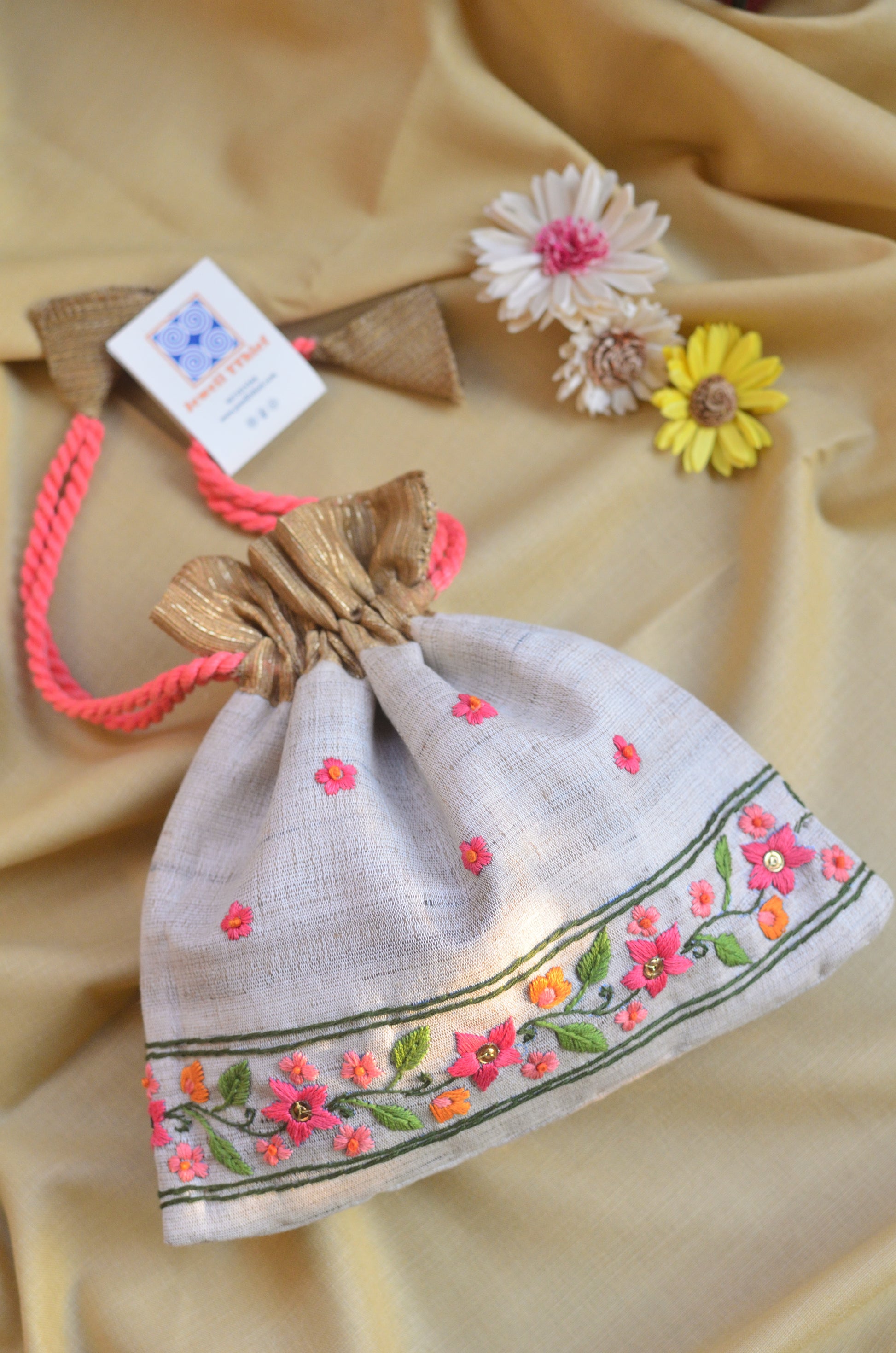 Snigdha - Off white raw silk potli with hand embroidered border image 0