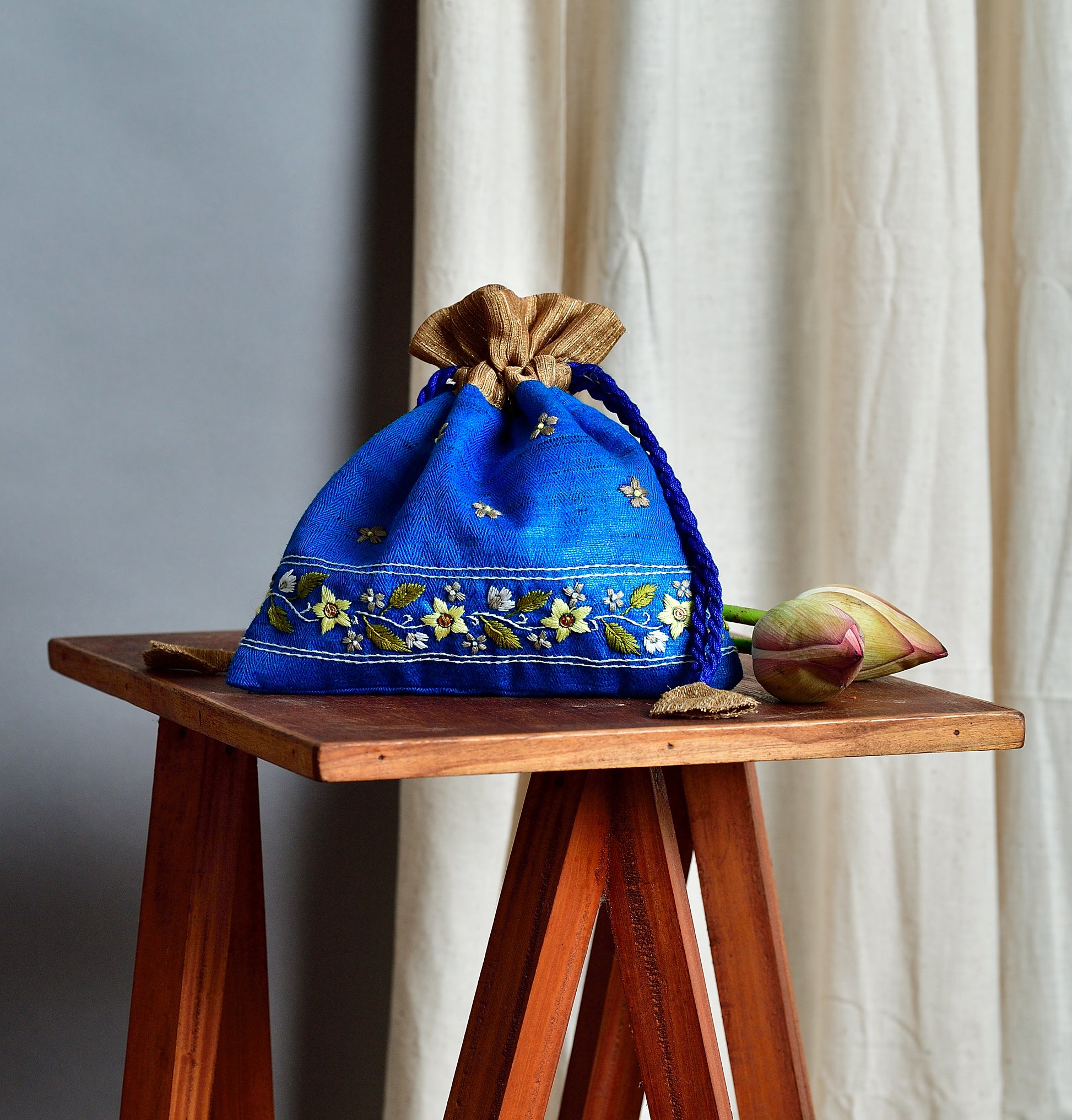Snigdha - royal blue raw silk potli with hand embroidered border image 1