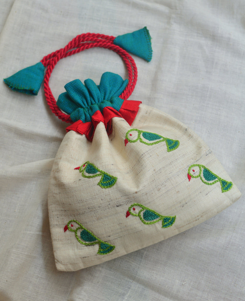 Tia - raw silk potli image 0